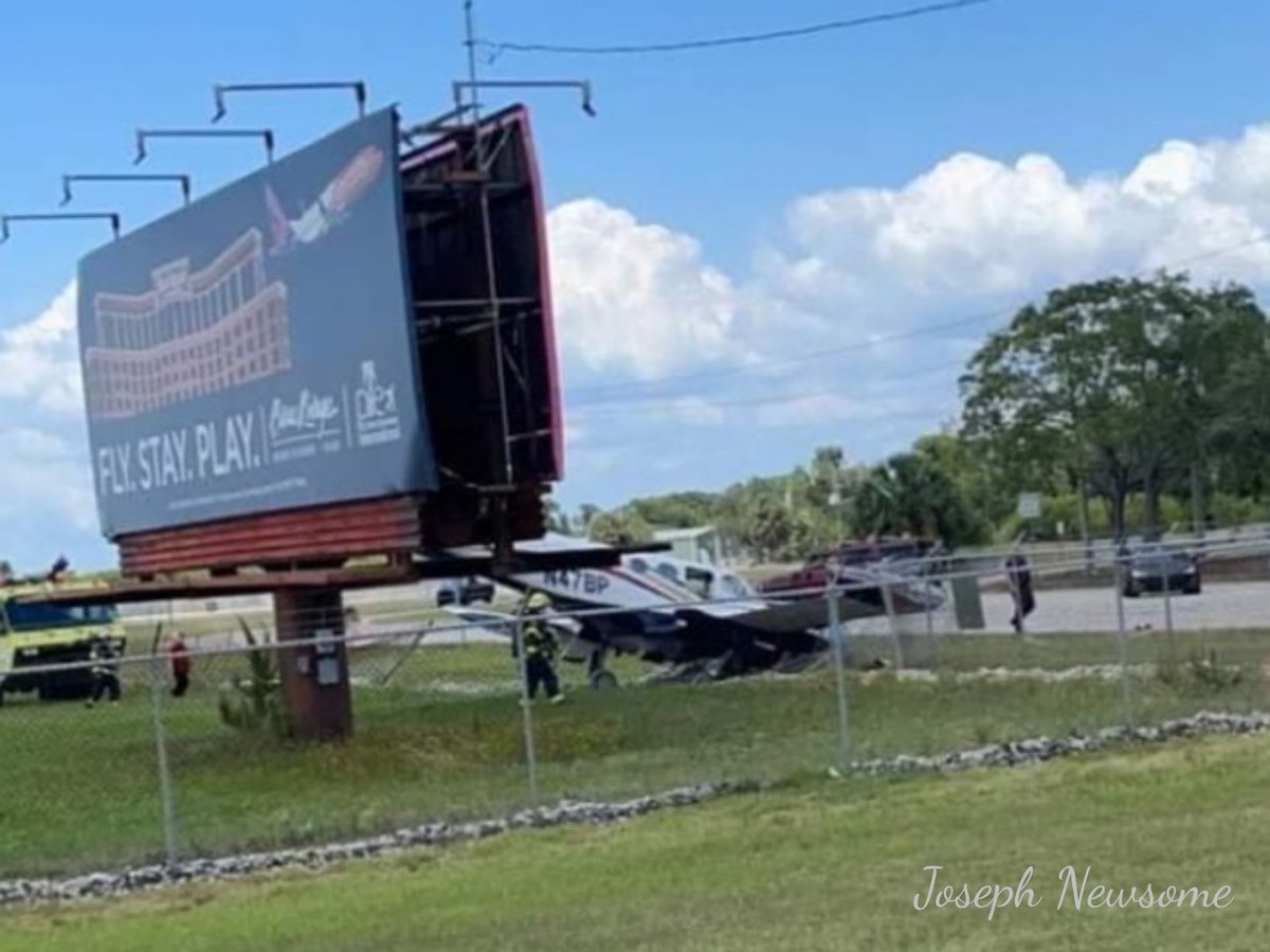 St. Pete Clearwater Airport: Small twin engine aircraft down into perimeter fence on Ulmerton side of airport. Pilot not injured. Substantial fuel leak reported