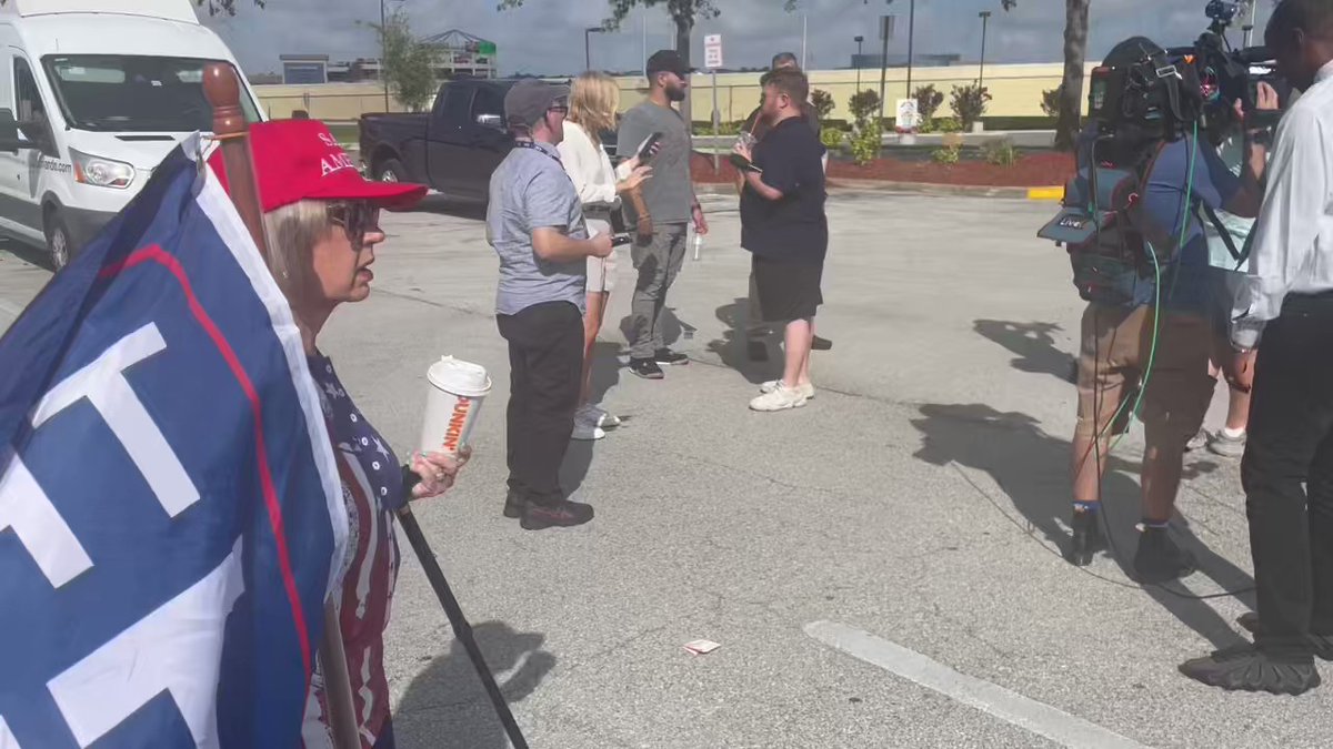 Trump supporters boarding 2 buses leaving from a @Walmart parking lot on JYP in Orlando