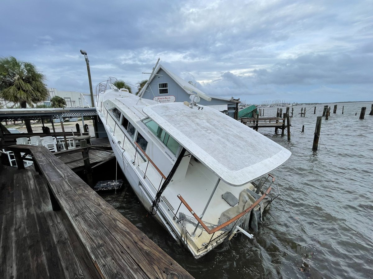 Idalia: Despite 2-4 feet of storm surge from Hurricane Idalia, this boat remains dislodged on the dock of this restaurant. The managers here at Bonita Bill's say it will take a crane to get this boat out of here