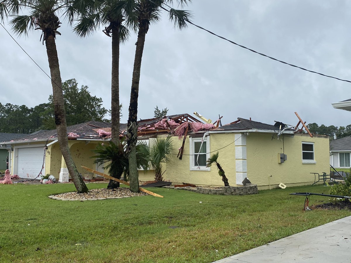 Palm Coast in a neighborhood where a roof has blown from the top of a house