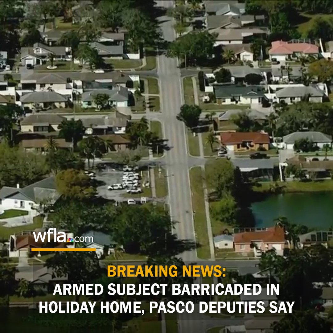 An armed person is barricaded inside a home in Holiday, Pasco County officials say