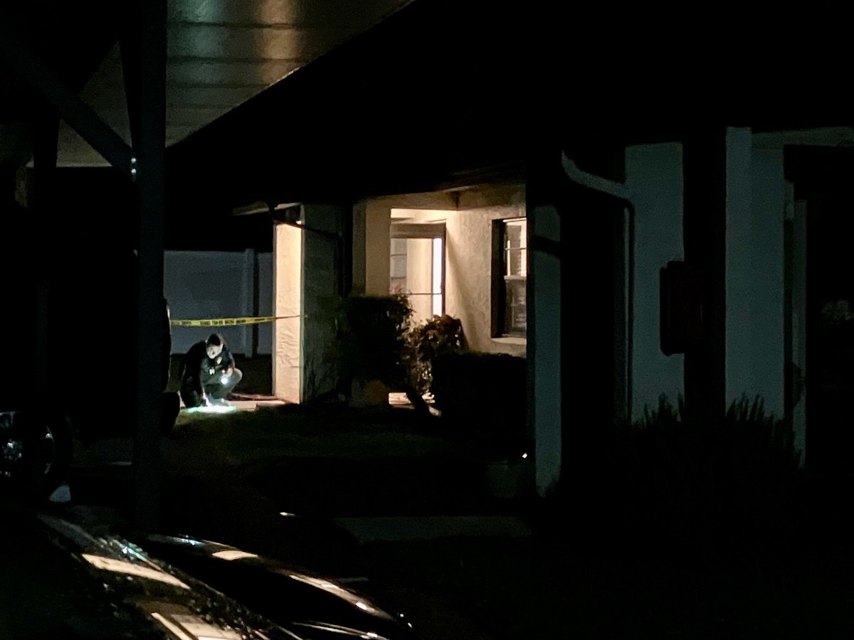DEPUTY-INVOLVED SHOOTING.  Crime Scene Unit van and crime scene tape surrounding a residence in Fort Pierce