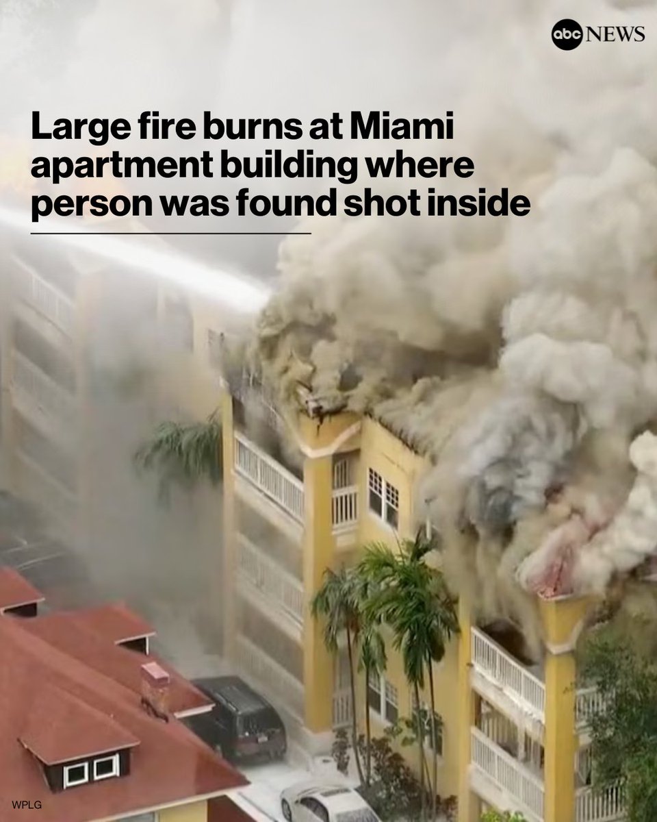 Firefighters are battling a large fire at a Miami residential building where a person was found shot inside, authorities said