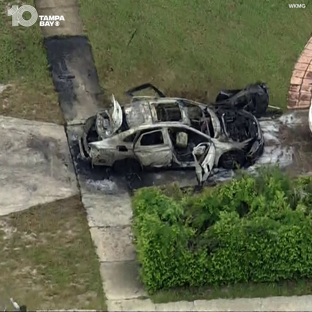 A woman died after the car she was in caught fire and burned outside a home in central Florida.